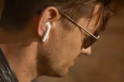 Man wearing wireless earbuds featuring ANC vs ENC noise cancellation technology