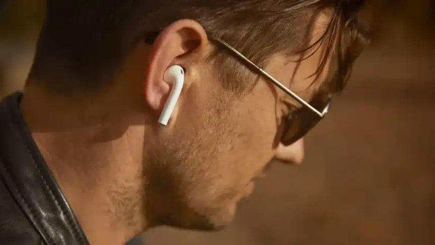 Man wearing wireless earbuds featuring ANC vs ENC noise cancellation technology