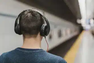 Man wearing wireless earbuds featuring ANC vs ENC noise cancellation technology