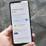Illustration showing a smartphone security audit with hidden software trackers, Bluetooth trackers, location tracking, and privacy settings on iPhone and Android devices.